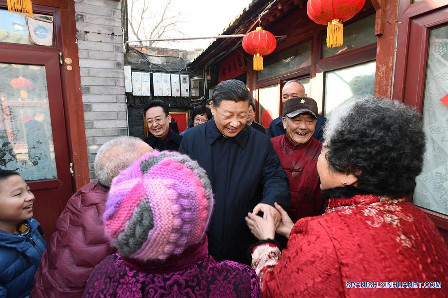 Xi visita a cuadros y residentes en Beijing antes de Fiesta de Primavera